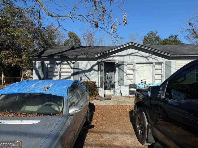a view of a two chairs in the patio