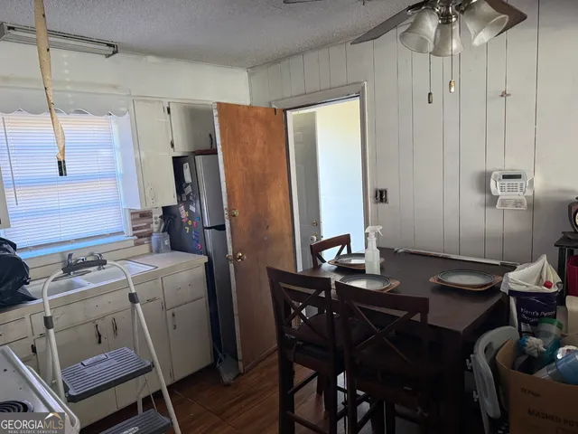 a kitchen with a table and chairs