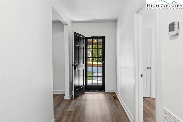 a view of an empty room with glass door