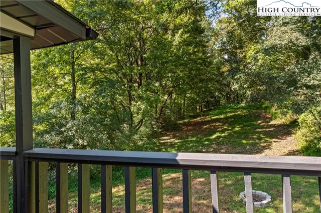 a view of a yard from a balcony