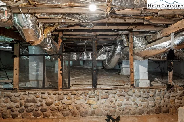 a utility room with multiple dryer and washer