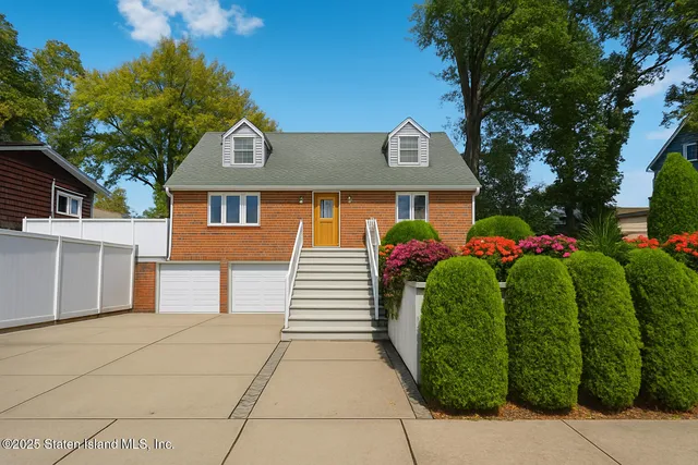 a front view of a house with a garage