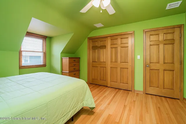 a view of a patio with table and chairs under an umbrella