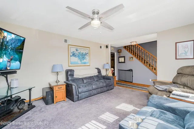 a kitchen with granite countertop a stove a sink and dishwasher wooden cabinets with granite countertops