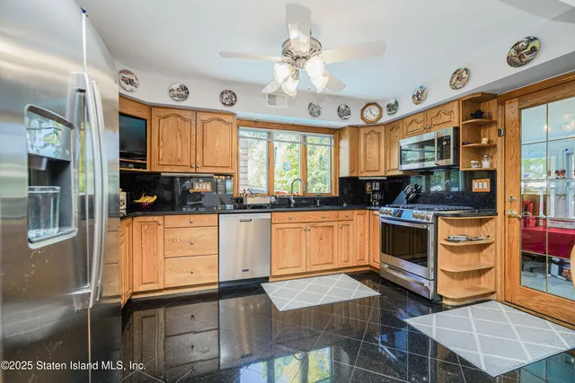 a dining room with furniture a chandelier and wooden floor