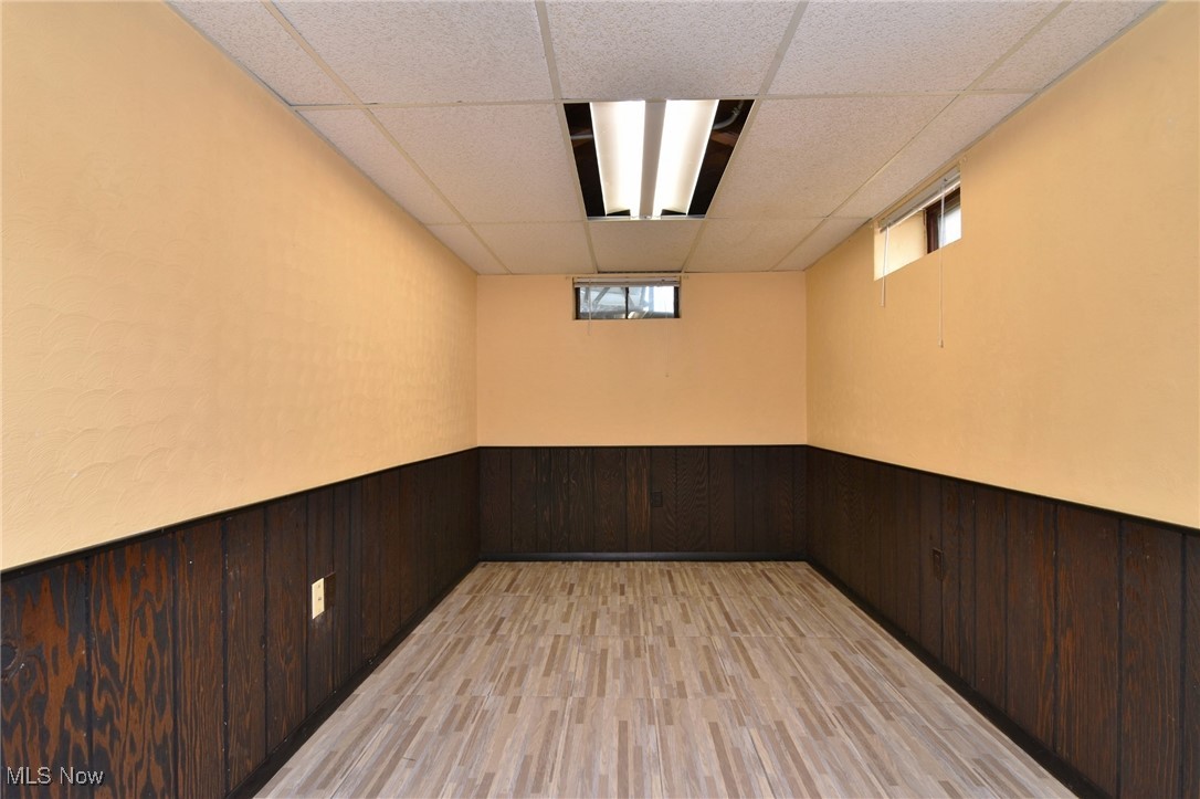 317 Nobottom Road Berea, OH 44017 - Photo 36 of 49 Spare room featuring light hardwood / wood-style floors and a drop ceiling