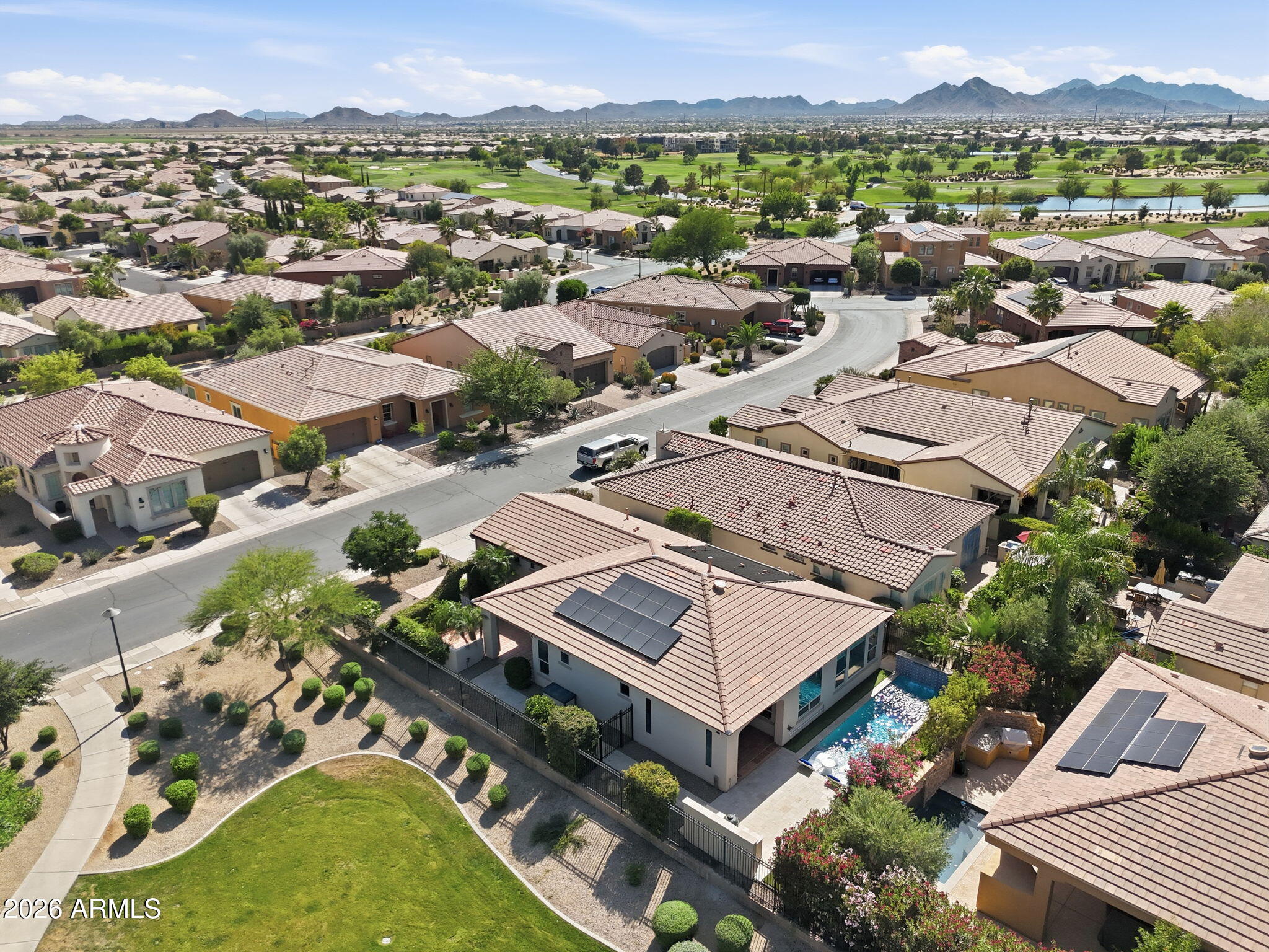 1694 East Grand Ridge Road Queen Creek, AZ 85140 - Photo 5 of 61 an aerial view of a house with a garden