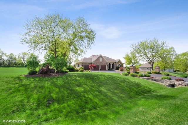 7313 Lone Oak Road Spring Grove, IL 60081 - Photo 2 of 29 a front view of a house with garden