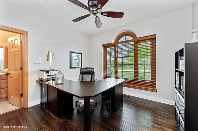 7313 Lone Oak Road Spring Grove, IL 60081 - Photo 13 of 29 a view of a dining room with furniture window and wooden floor