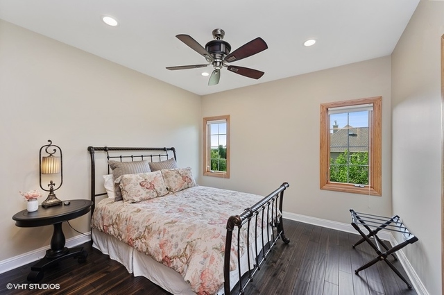 7313 Lone Oak Road Spring Grove, IL 60081 - Photo 17 of 29 a bedroom with a bed and window