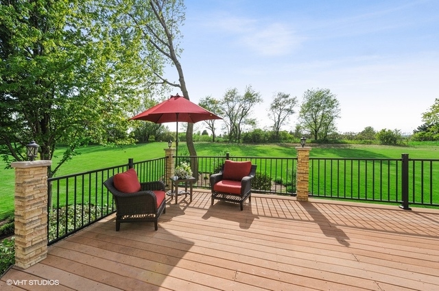 7313 Lone Oak Road Spring Grove, IL 60081 - Photo 25 of 29 a view of a deck with furniture and yard