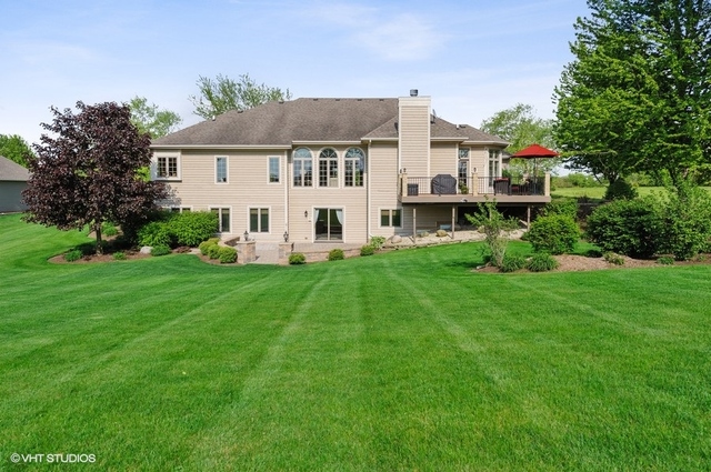 7313 Lone Oak Road Spring Grove, IL 60081 - Photo 29 of 29 a view of a house with a yard and sitting area