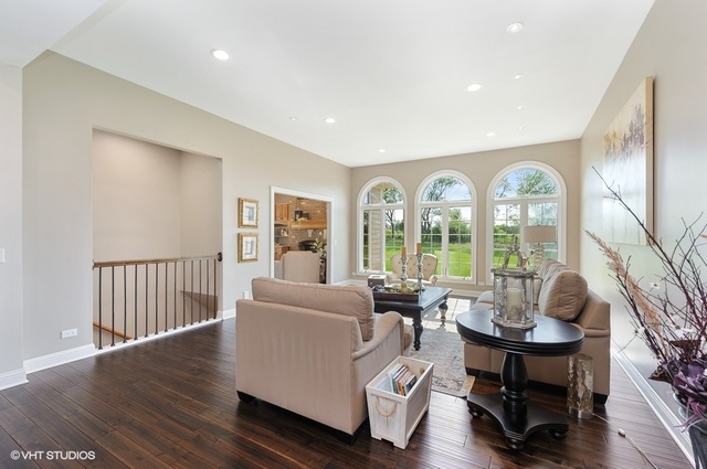 7313 Lone Oak Road Spring Grove, IL 60081 - Photo 5 of 29 a living room with furniture and a large window