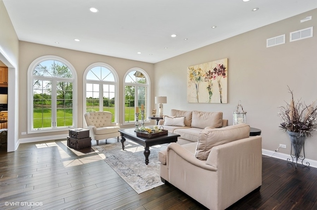7313 Lone Oak Road Spring Grove, IL 60081 - Photo 6 of 29 a living room with furniture and a large window