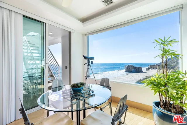 a bedroom with furniture and white walls
