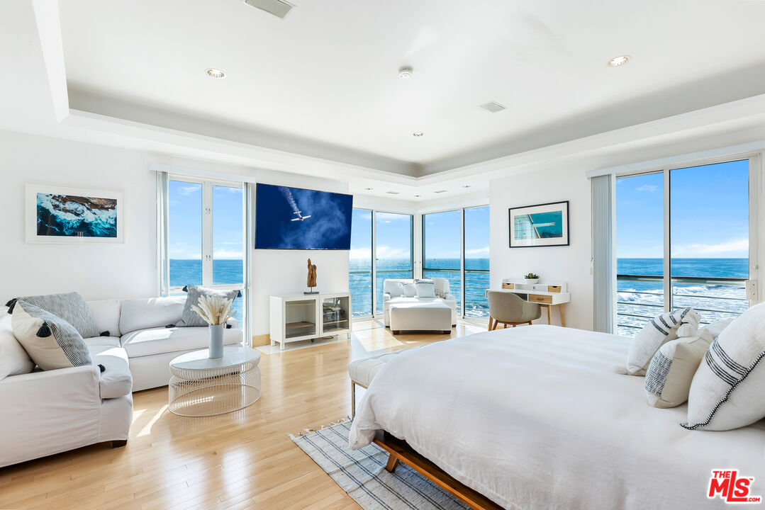 32062 Pacific Coast Highway Malibu, CA 90265 - Photo 17 of 31 a bedroom with furniture and white walls