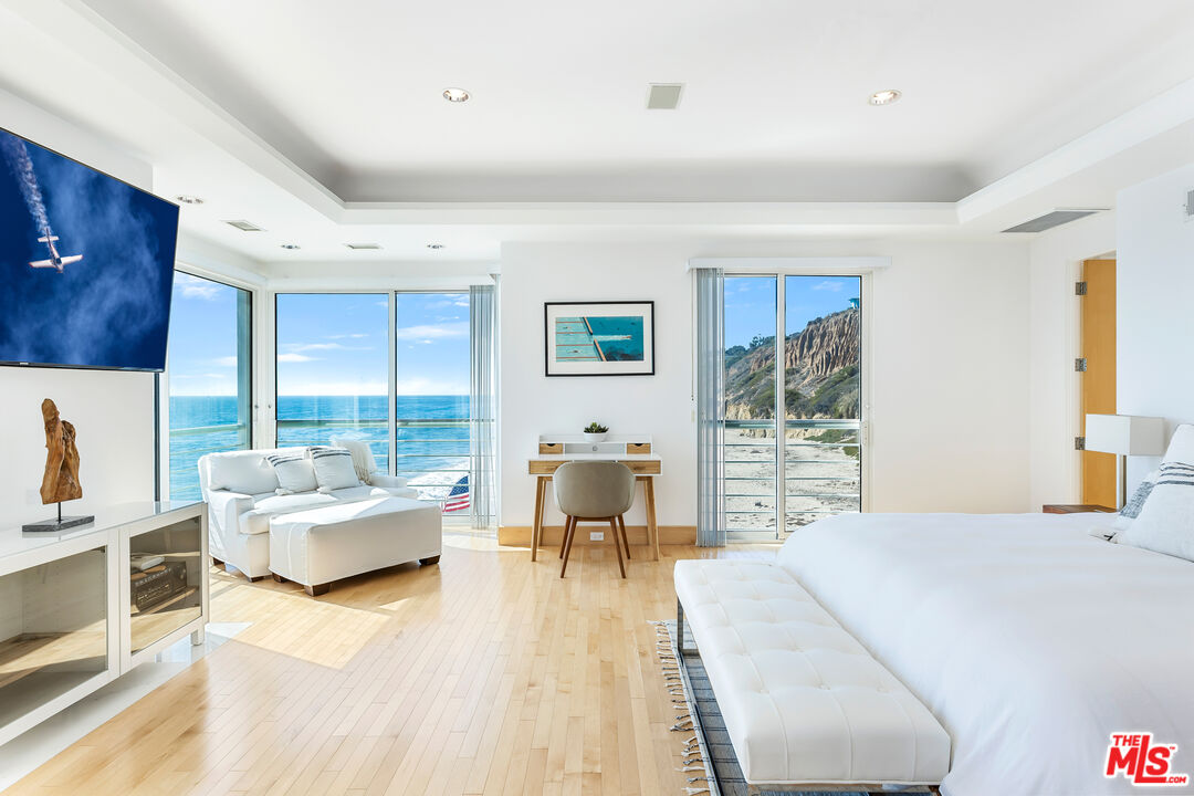 32062 Pacific Coast Highway Malibu, CA 90265 - Photo 18 of 31 a bedroom with furniture and a large window