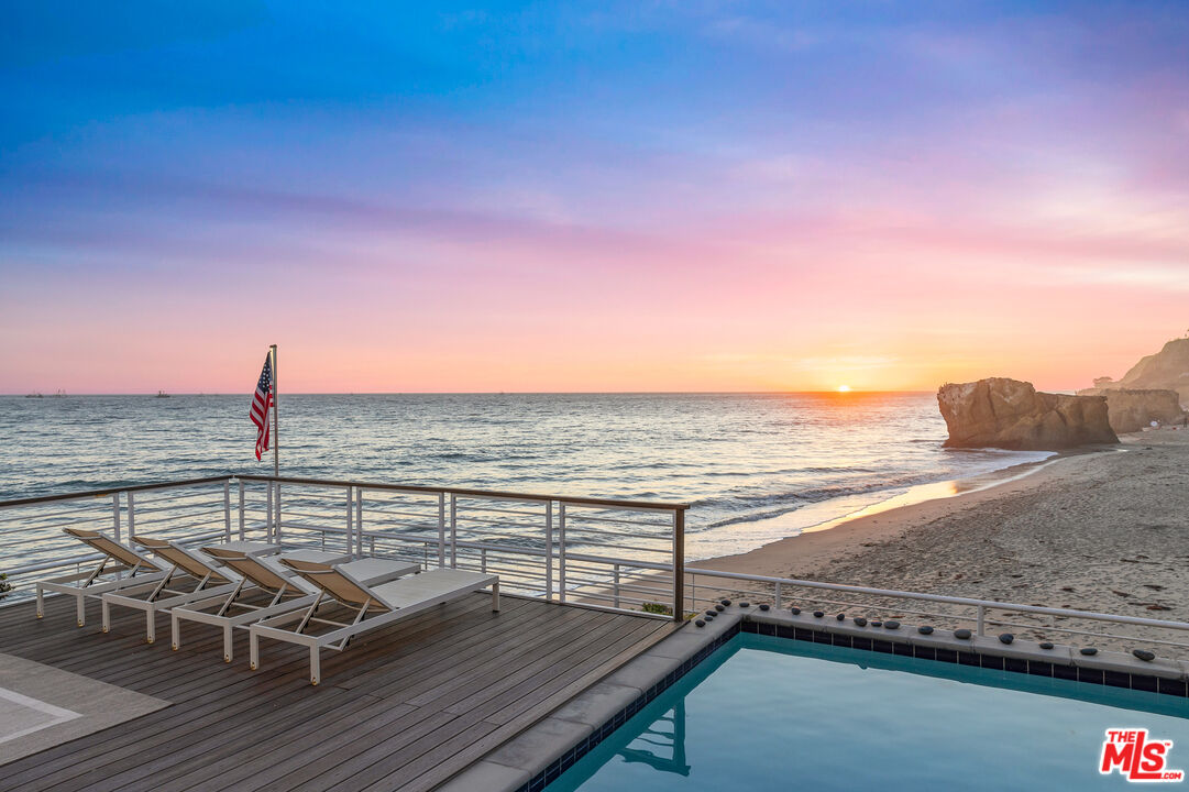 32062 Pacific Coast Highway Malibu, CA 90265 - Photo 27 of 31 a view of a terrace with wooden floor and ocean view