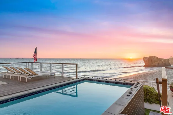 a view of a balcony with an ocean view