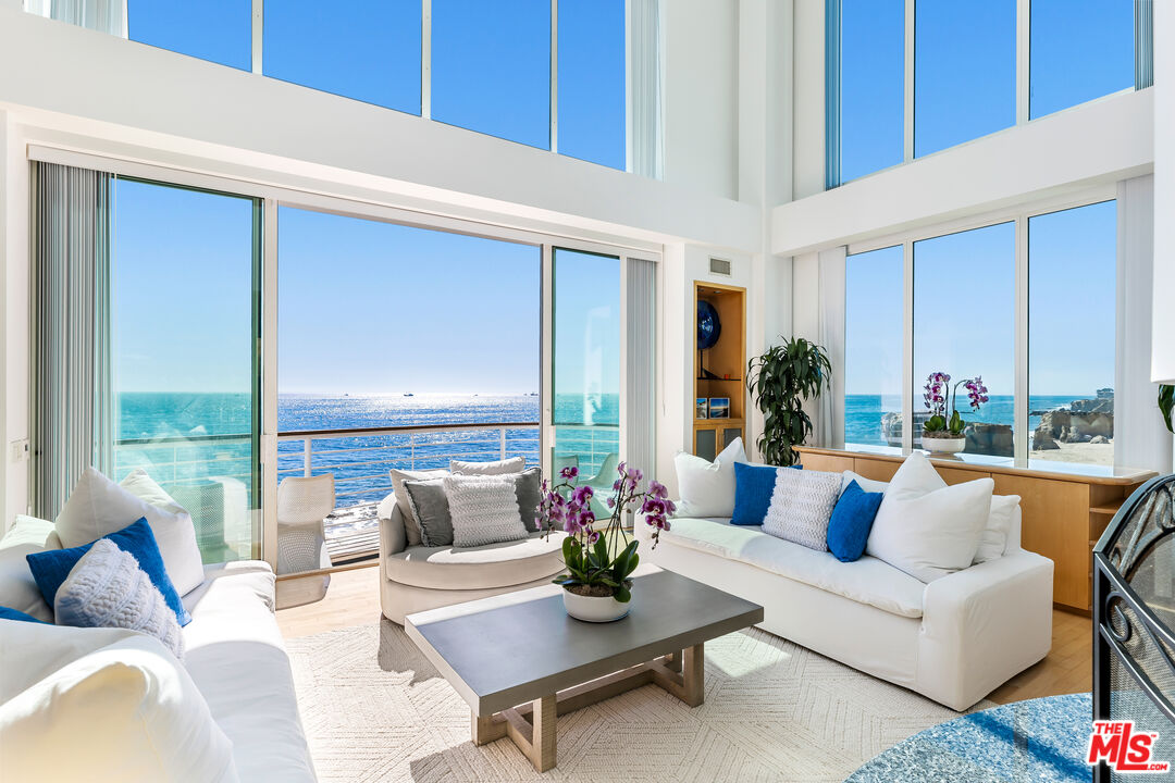 32062 Pacific Coast Highway Malibu, CA 90265 - Photo 7 of 31 a living room with furniture potted plant and a large window