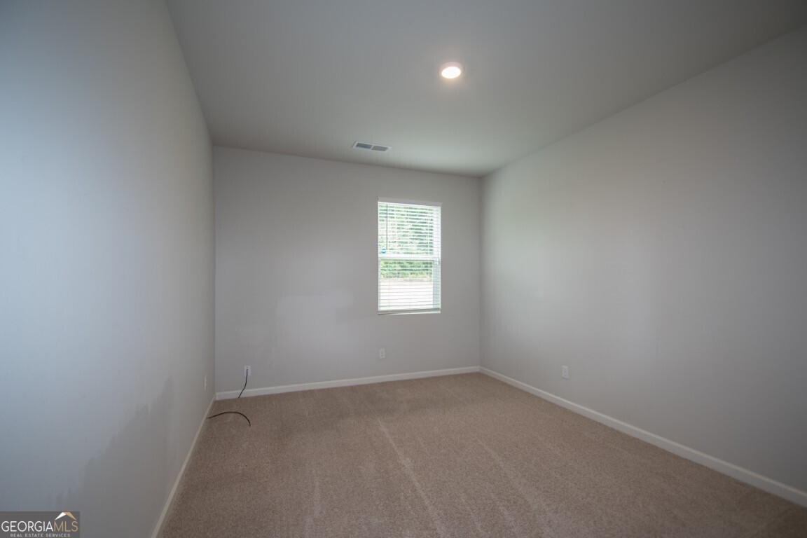8084 Louis Drive Locust Grove, GA 30248 - Photo 18 of 33 an empty room with a window
