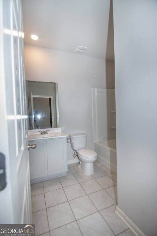 8084 Louis Drive Locust Grove, GA 30248 - Photo 19 of 33 a bathroom with a toilet a sink and mirror