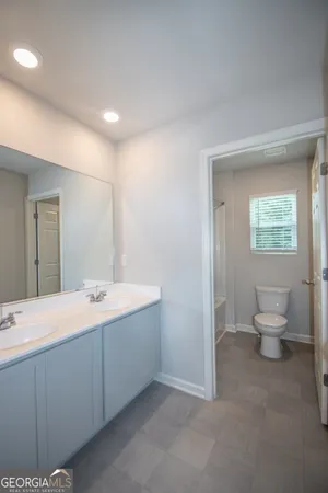 a bathroom with a toilet and a bathtub