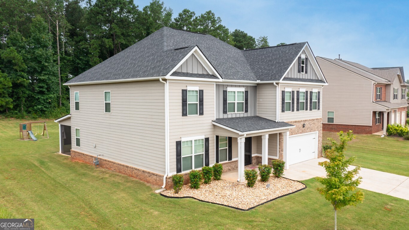 8084 Louis Drive Locust Grove, GA 30248 - Photo 2 of 33 a aerial view of a house with a yard