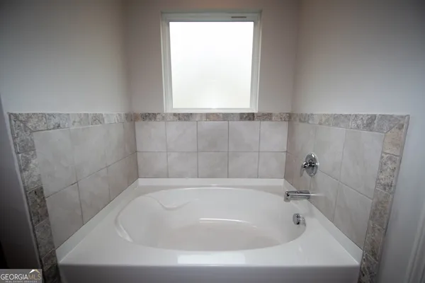 a bathroom with a shower and a bathtub