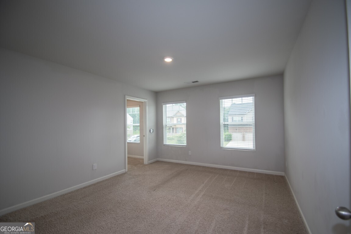 8084 Louis Drive Locust Grove, GA 30248 - Photo 31 of 33 an empty room with windows