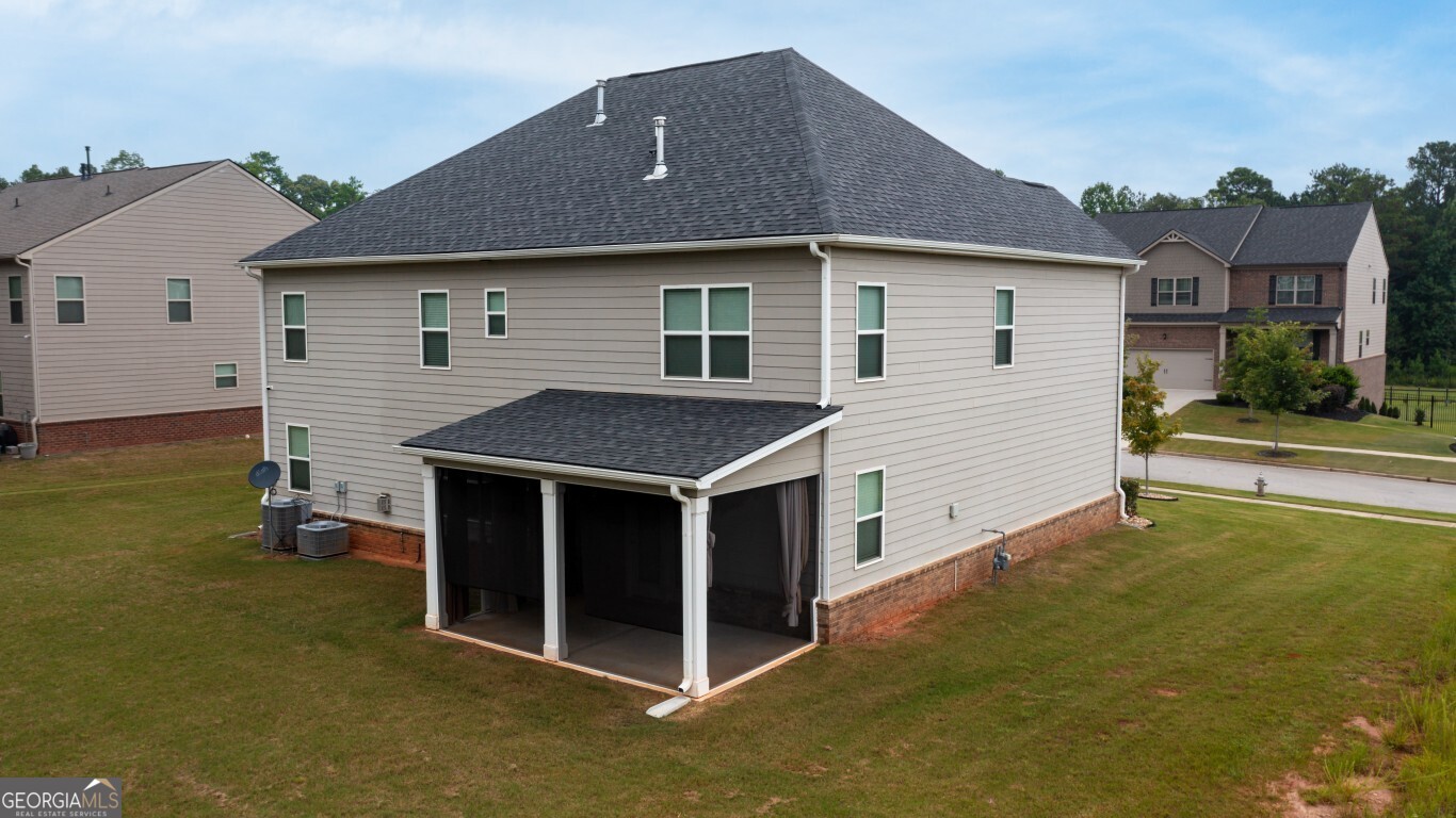 8084 Louis Drive Locust Grove, GA 30248 - Photo 4 of 33 a house view with a outdoor space