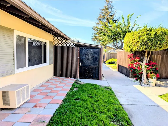a front view of a house with a yard and a garage