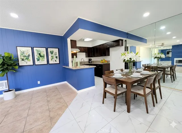 a kitchen with a table and chairs in it