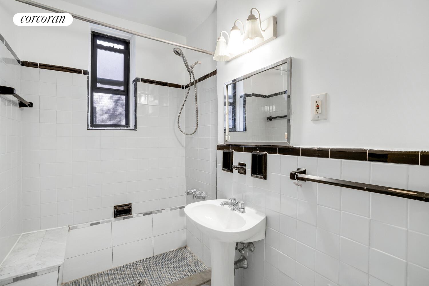345 Webster Avenue, Unit 1G Brooklyn, NY 11230 - Photo 11 of 12 a bathroom with a sink and mirror