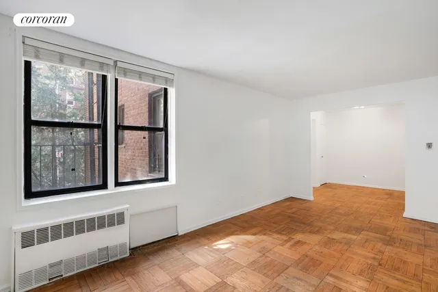 a view of an empty room with a window