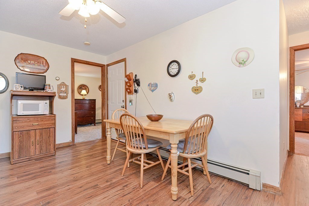 29 Winter Street Fall River, MA 02720 - Photo 14 of 34 a view of a dining room with furniture and wooden floor
