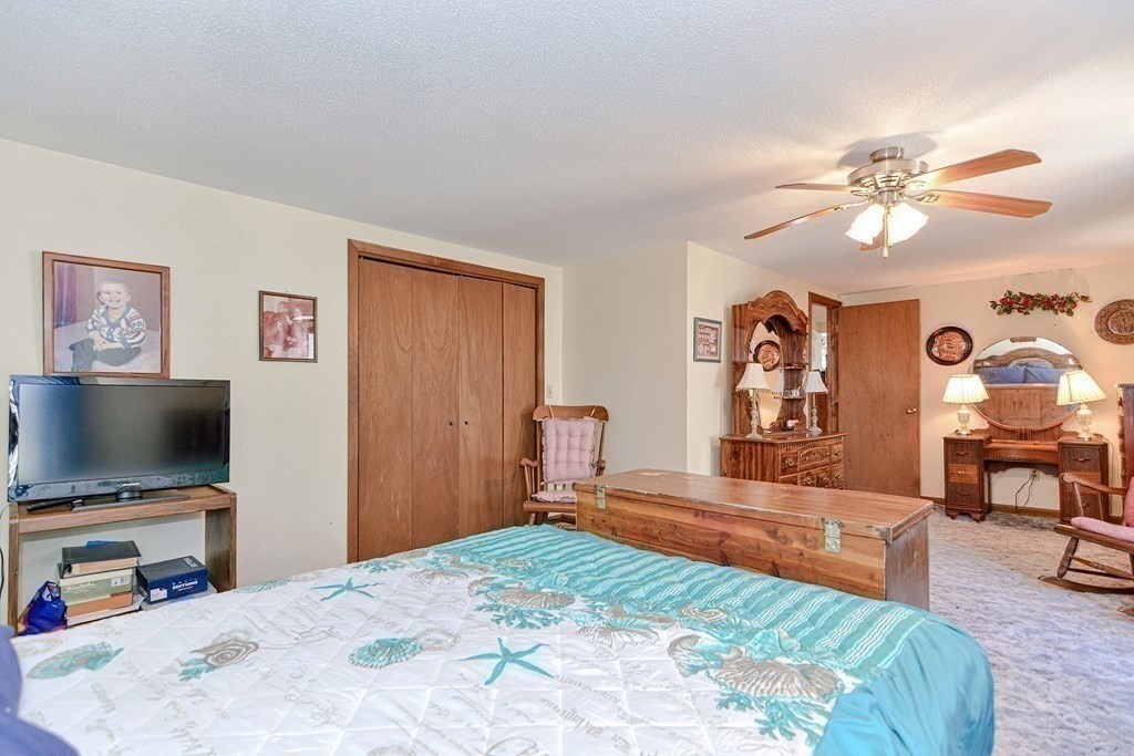 29 Winter Street Fall River, MA 02720 - Photo 19 of 34 a bedroom with a bed and a flat screen tv