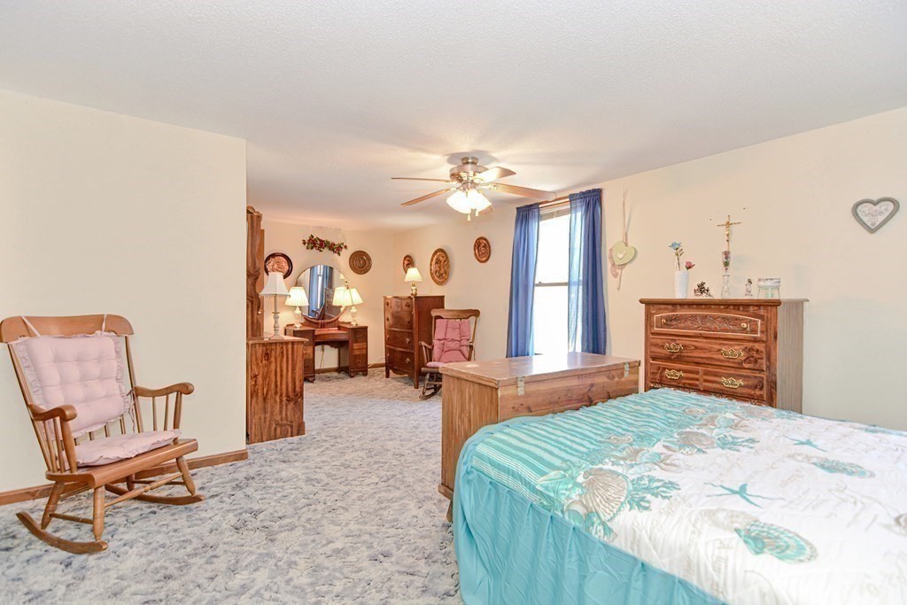 29 Winter Street Fall River, MA 02720 - Photo 20 of 34 a bedroom with furniture and a chair