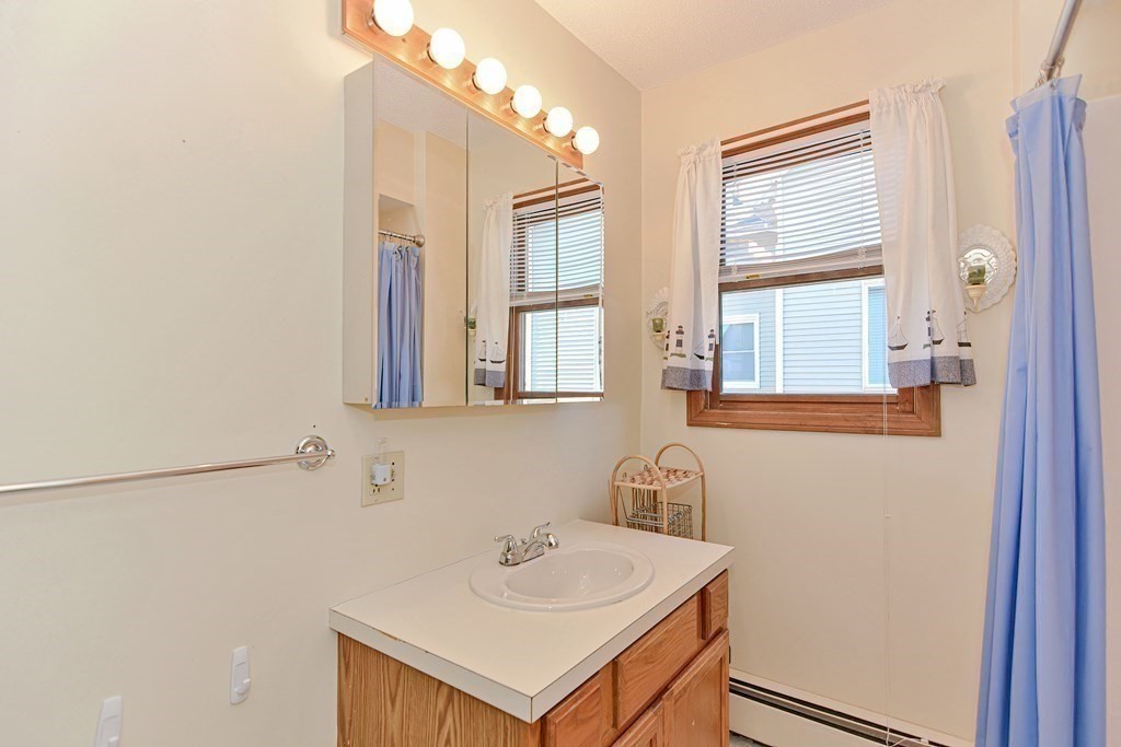 29 Winter Street Fall River, MA 02720 - Photo 26 of 34 a bathroom with a sink and a mirror
