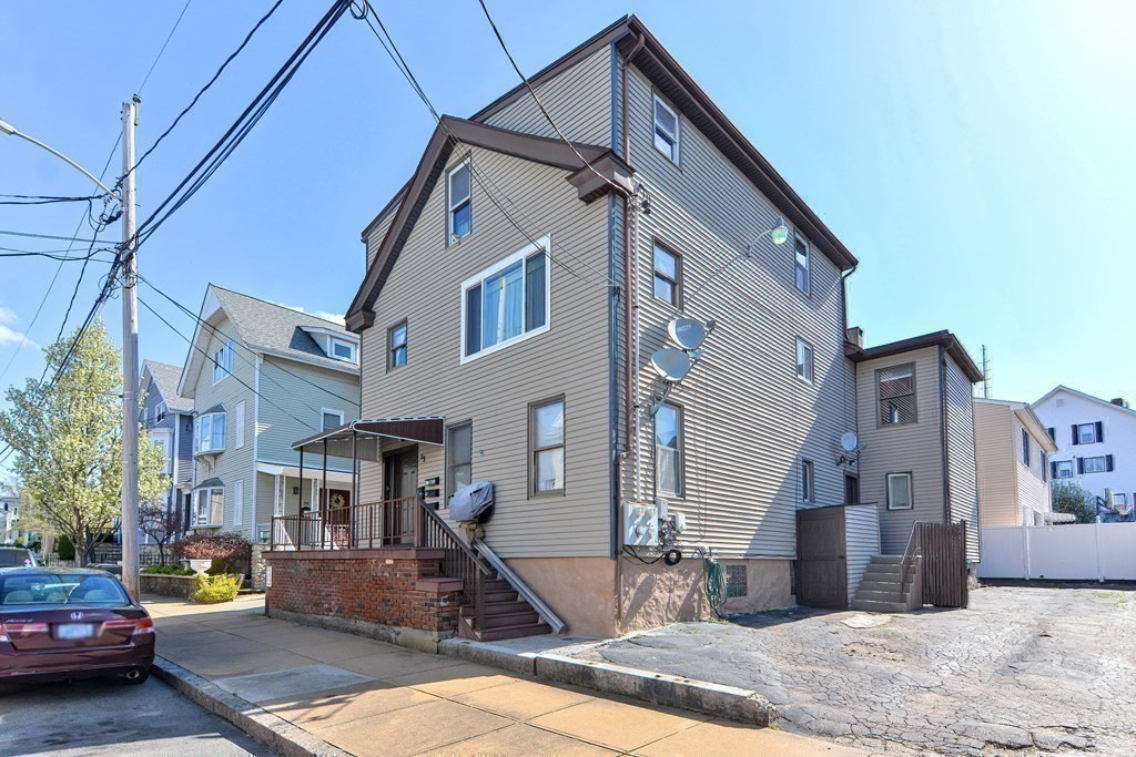 29 Winter Street Fall River, MA 02720 - Photo 33 of 34 a front view of a house with a yard