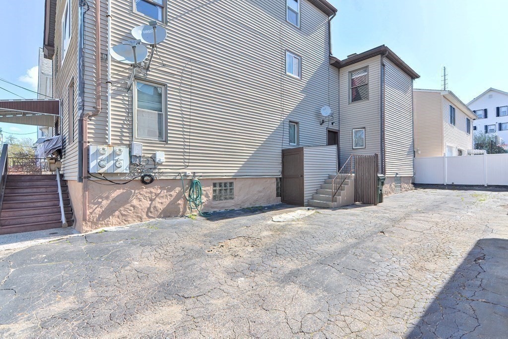 29 Winter Street Fall River, MA 02720 - Photo 34 of 34 a view of a house with a yard and garage