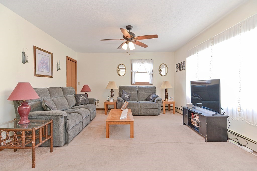 29 Winter Street Fall River, MA 02720 - Photo 6 of 34 a living room with furniture and a flat screen tv