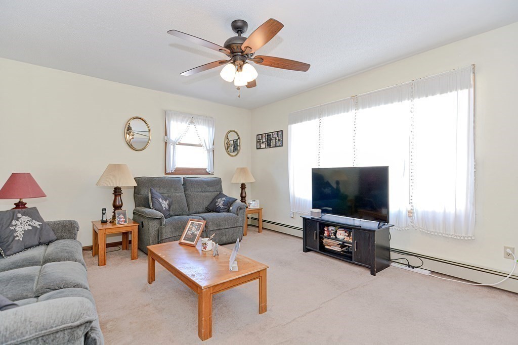29 Winter Street Fall River, MA 02720 - Photo 7 of 34 a living room with furniture and a flat screen tv