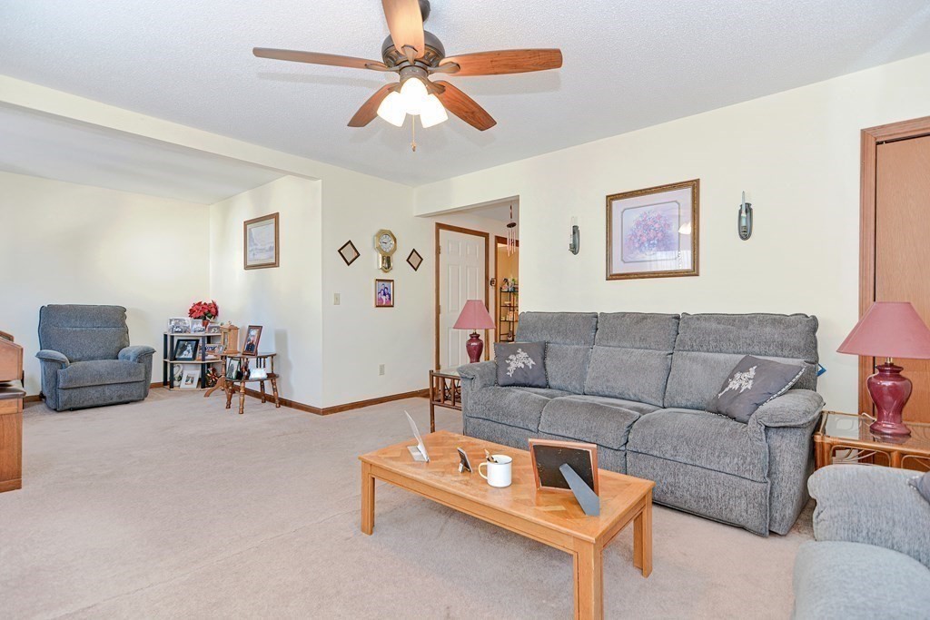 29 Winter Street Fall River, MA 02720 - Photo 9 of 34 a living room with furniture and a flat screen tv
