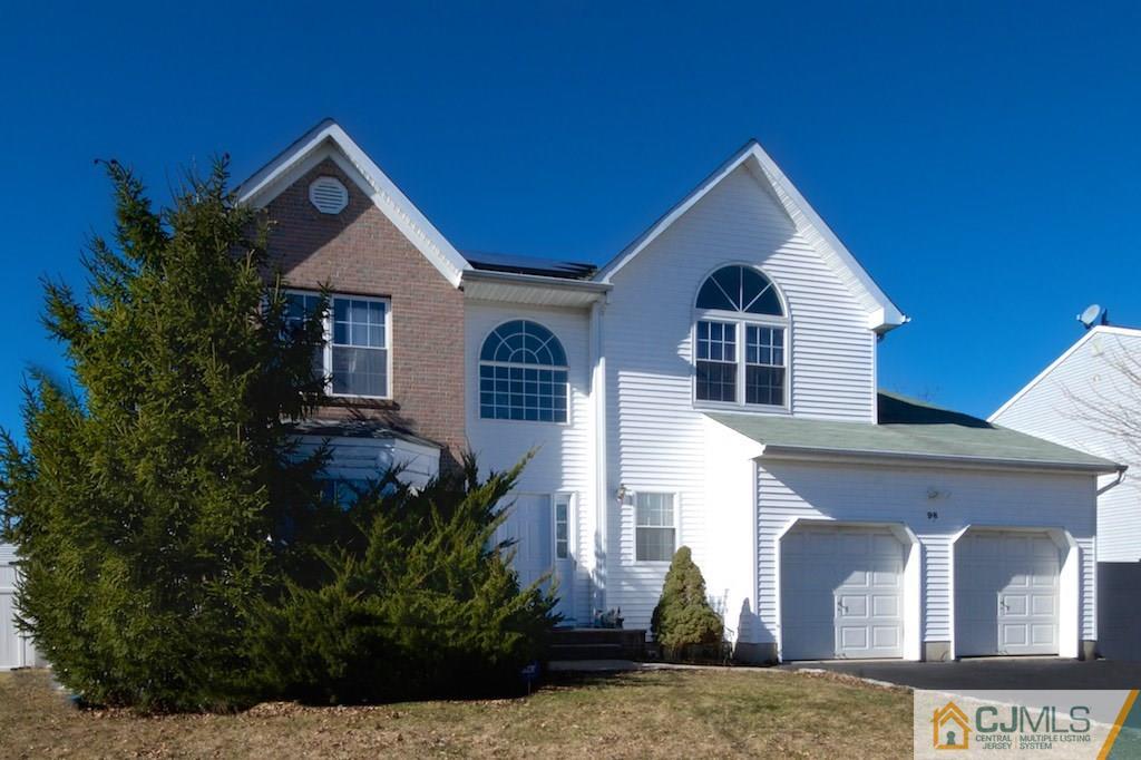 98 New Brooklyn Road Edison, NJ 08817 - Photo 1 of 21 a front view of a house with garden