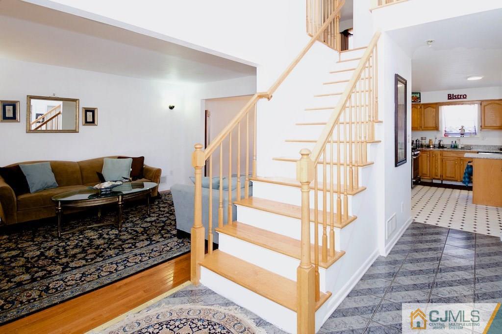 98 New Brooklyn Road Edison, NJ 08817 - Photo 2 of 21 a living room with furniture and a rug