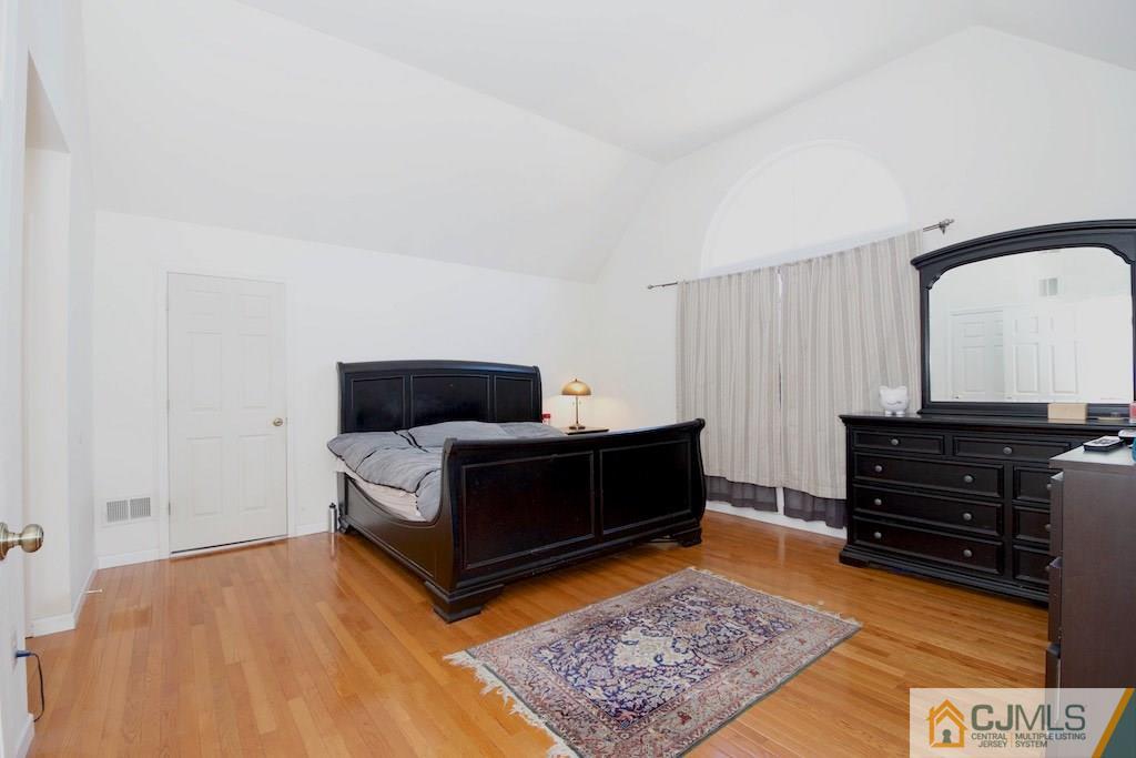 98 New Brooklyn Road Edison, NJ 08817 - Photo 12 of 21 a living room with furniture and a rug