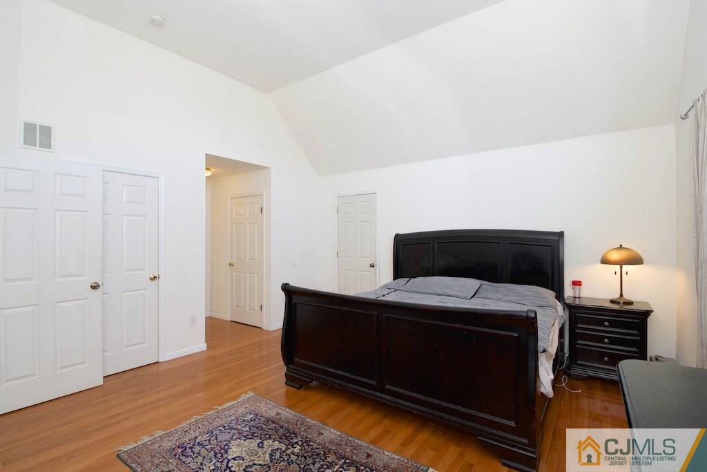 98 New Brooklyn Road Edison, NJ 08817 - Photo 13 of 21 a bedroom with a bed and wooden floor