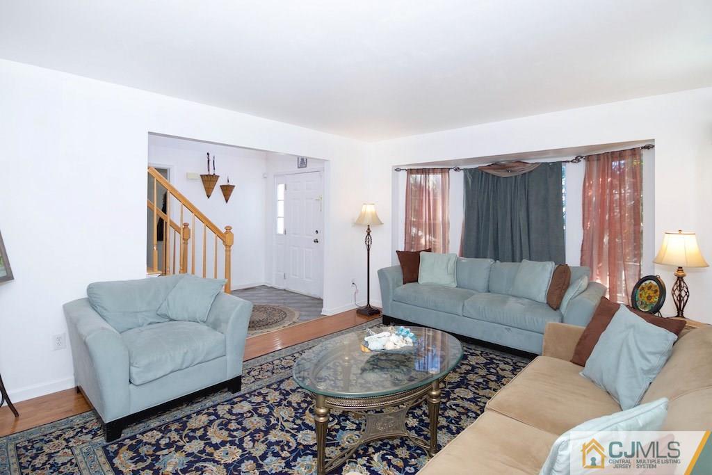 98 New Brooklyn Road Edison, NJ 08817 - Photo 3 of 21 a living room with furniture and a couch