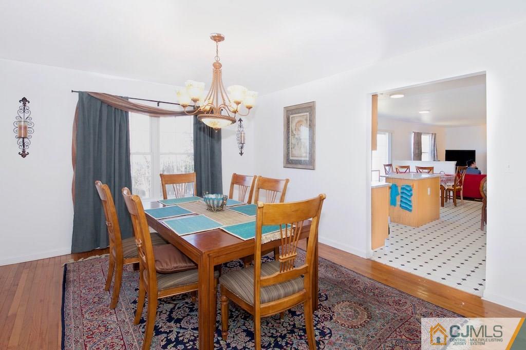 98 New Brooklyn Road Edison, NJ 08817 - Photo 6 of 21 a dining room with furniture and wooden floor